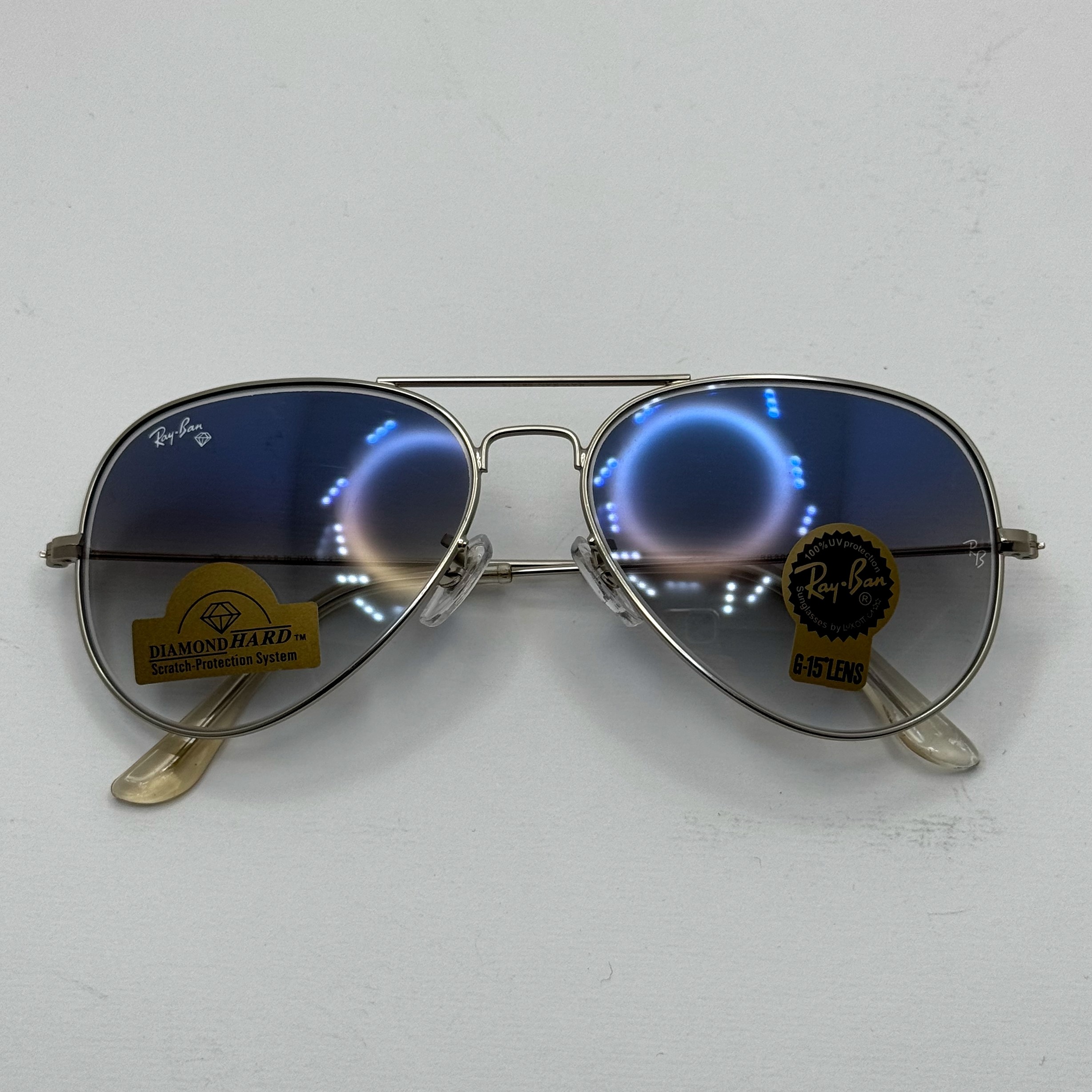 عینک ریبن خلبانی شیشه سنگ آبی هایلایت فریم نقره ای به همراه پک کامل ریبن Rayban RB 3025